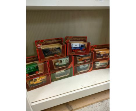 Shelf of match box yesteryears advertising trucks . 