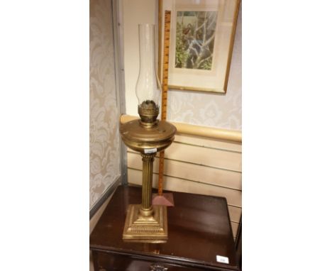 Huge Solid Brass Corinthian column  oil lamp on heavy brass squared base stands 28 inches in height . 