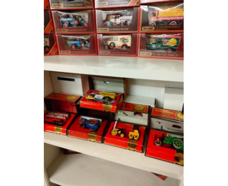 Shelf of matchbox steam rollers , vans etc all boxed. 