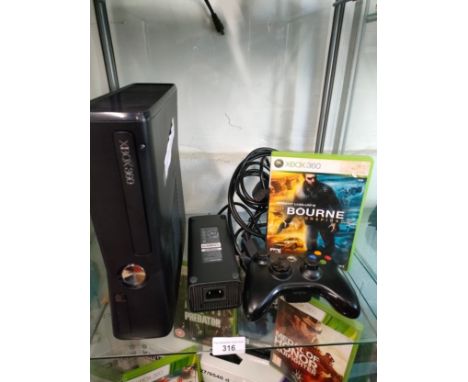 Xbox 360 console with game and controller . 