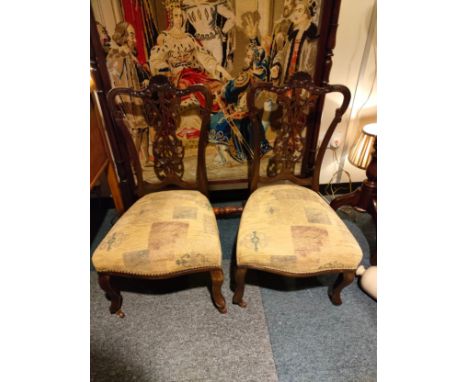 Pair of Victorian Parlour chairs with ceramic caster feet  . 