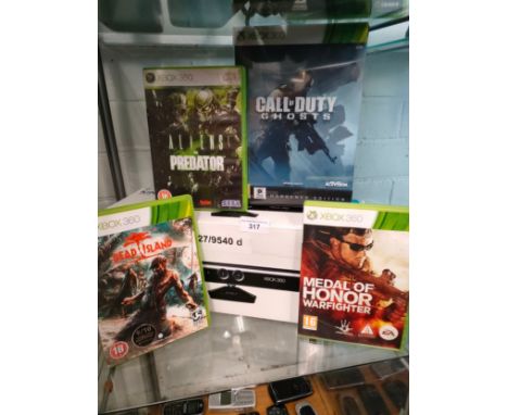 Shelf of xbox related items includes call duty game set , boxed kinnect etc. 