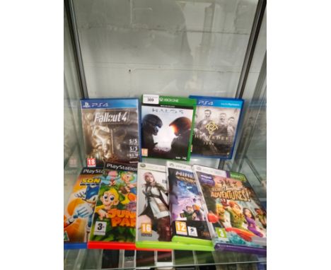 Shelf of ps4 games etc . 