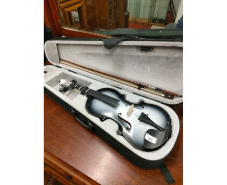 Violin with bow in fitted case . 