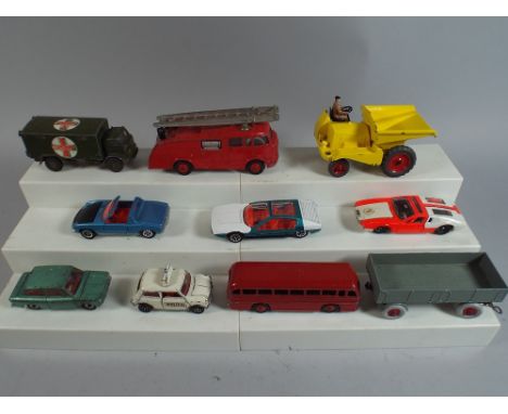 A Collection of Ten Dinky Toys including Fire Engine, Hillman Imp, Mini Cooper Police, Leyland Royal Tiger, Dumper etc