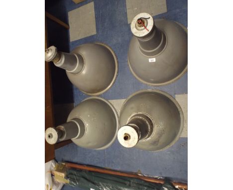 A Collection of Four Grey Enamelled Industrial Lamp Shades 