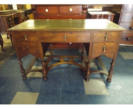 An Edwardian Desk of One Long Flanked by Two Short Drawers Carved Stretcher Shelf and on Bun Feet with Green Tooled Leather T