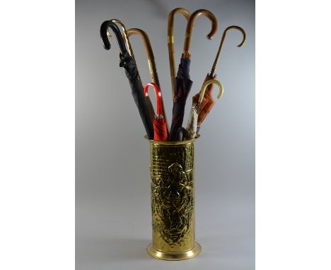 A Brass Stick Stand Containing Walking Sticks, Umbrellas etc