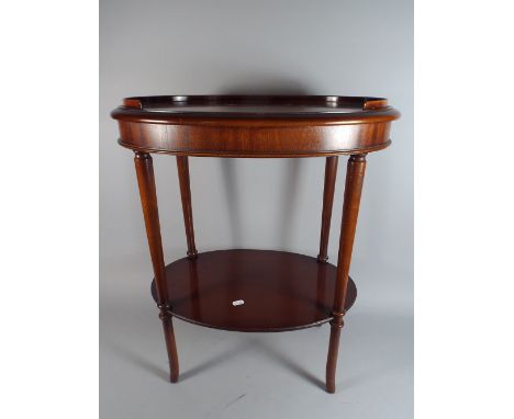 A Small Flame Mahogany Occasional Table with Stretcher Shelf on Turned Tapering Supports