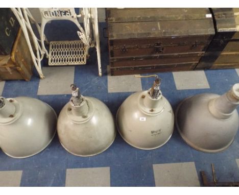 A Collection of Four Grey Industrial Enamelled Lamp Shades 