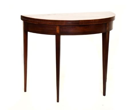 19th Century Sheraton style satinwood crossbanded mahogany demi lune fold over card table standing on tapered square supports