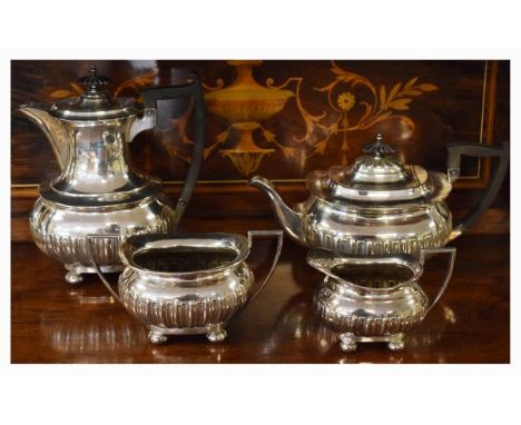 Silver plated four piece tea service, each piece having part fluted decoration and standing on ball feet   Condition: 