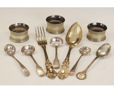Continental white metal fork and spoon, four silver mustard spoons, 2.7toz approx, together with three silver plated napkin r