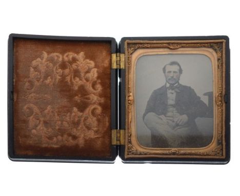 19th Century ambrotype depicting a seated gentleman in a floral decorated union type frame/case   Condition: 