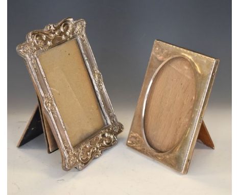 Edward VII embossed silver easel picture frame, Birmingham 1906, together with a George V silver easel picture frame, Birming