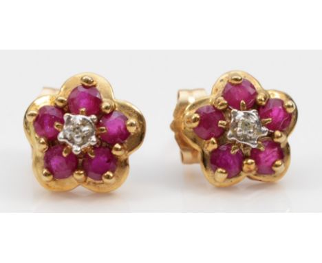 A pair of 9ct gold ruby and diamond ear studs, 1.2gm