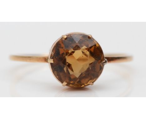 A 9ct gold and citrine single stone ring, R 1/2, 2gm