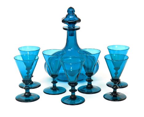A part suite of glass  19th century, including a heavy faceted decanter and stopper, starcut to the base, and seven drawn tru