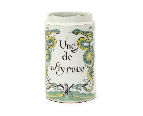 A French faïence albarello  late 18th century, Paris or Rouen, the cylindrical form inscribed in manganese with 'Ung. de Styr