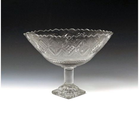 A large cut glass footed bowl or comport  early 19th century, probably Irish, of navette shape, cut with diamond panels betwe