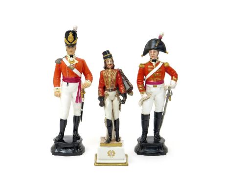 Two Royal Worcester figures of soldiers 1941 and later, one of an Officer of the Dragoon Guards, wearing a bicorn hat and lea