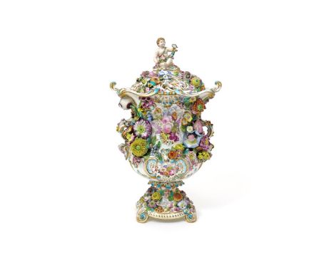 An impressive Minton porcelain vase and cover  c.1830, the urn shape richly applied with a variety of flowers, painted to one