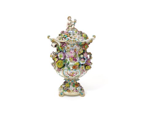 An impressive Minton porcelain vase and cover  c.1830, the urn shape richly applied with a variety of flowers, painted to one