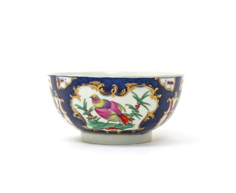 A Worcester slop bowl   c.1770, painted with panels of fancy birds perched on the ground between berried branches, and with f