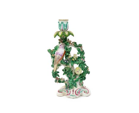A Derby candlestick group of finches  c.1760-65, modelled as two colourful birds perched among flowering branches, raised on 