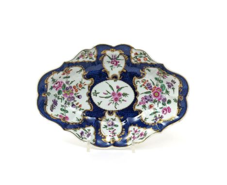 A Worcester lozenge-shaped dessert dish  c.1770-75, painted with two large panels of European flowers with smaller panels con