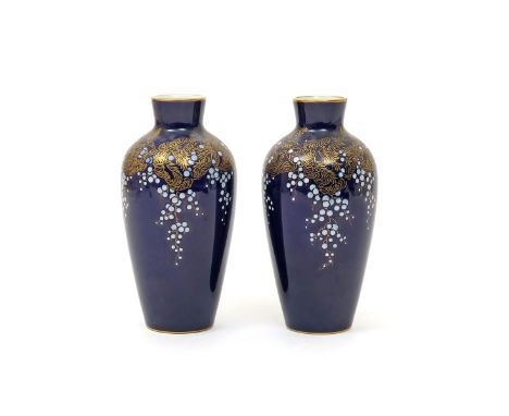 A pair of Sèvres vases  c.1920, simply decorated with continuous bands of wisteria with white enamelled flowers and gilt foli