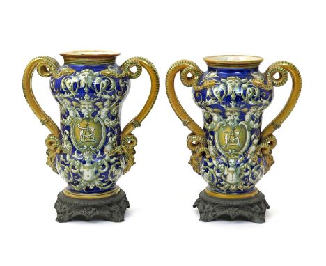 A large pair of Cantagalli maiolica vases  late 19th/early 20th century, of dumbbell albarello form, painted in grey and ochr