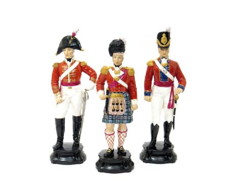 Three Royal Worcester figures of soldiers  mid 20th century, one of an Officer of the Dragoon Guards, one an Officer of the C