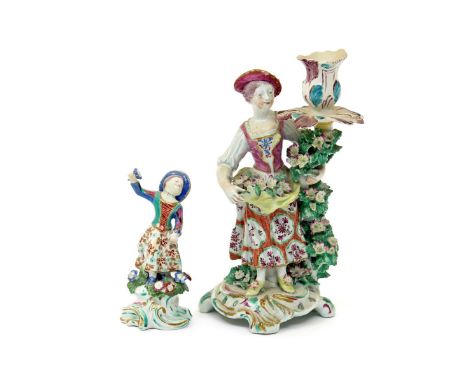 A Bow candlestick figure  c.1760, of a girl with flowers in her apron, her left arm around a flowering branch which supports 