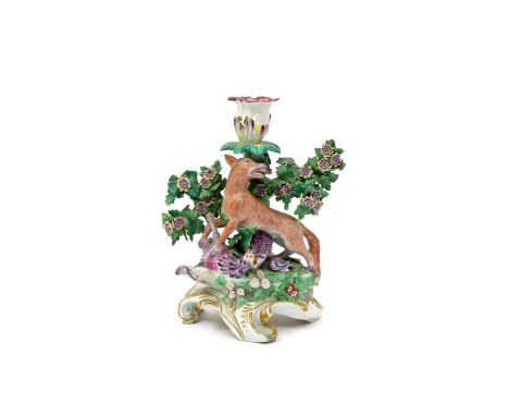 A Chelsea candlestick figure group  c.1760, modelled in the Fable manner with a fox and a hen, the fox looking back over his 