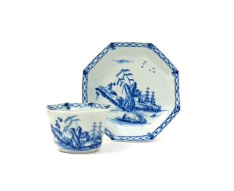 A Worcester blue and white octagonal teabowl and saucer  c.1755, painted with the Romantic Rocks pattern, a figure carrying a