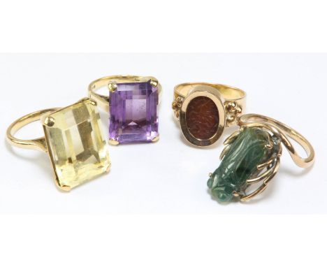 Four gem set rings, including a single stone amethyst ring, size J1/2 and a single stone citrine ring, size K, both in 9ct go