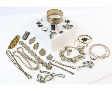 A collection of silver and costume jewellery, including a Daniel Swarovski amethyst cocktail ring, a silver charm bracelet a 