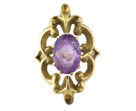 An amethyst and gold ring, central oval cut amethyst measuring approximately 8.54 x 1.82 x 5.19mm, claw set, surrounded by op