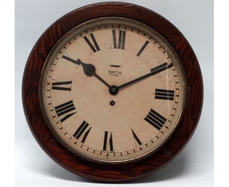 A 20th century Smiths eight day wall clock - with a pine case, the cream dial set out with Roman numerals, diameter 40cm.
