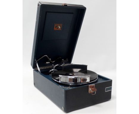 A portable gramophone, HMV Model 102, in blue case, circa 1935, with an unusual chrome record carrier.