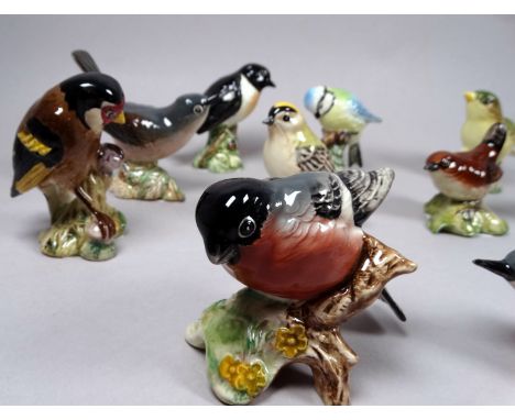 A Beswick model of a Bullfinch - height 6cm, together with ten further Beswick models of birds.