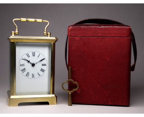 A 20th century carriage timepiece - with a corniche case and white enamel dial set out in Roman numerals, height 12cm, with a
