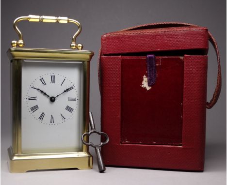 A 20th century carriage timepiece - with corniche case and white enamel dial set out in Roman numerals, height 12cm, with a f