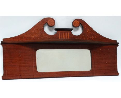 An Edwardian mahogany overmantel mirror - with a broken arch pediment with foliate inlay above a shelf and rectangular mirror