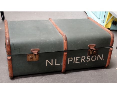 A 20th century trunk - blue oil cloth with beech banding and a chequered fabric interior, width 85cm.