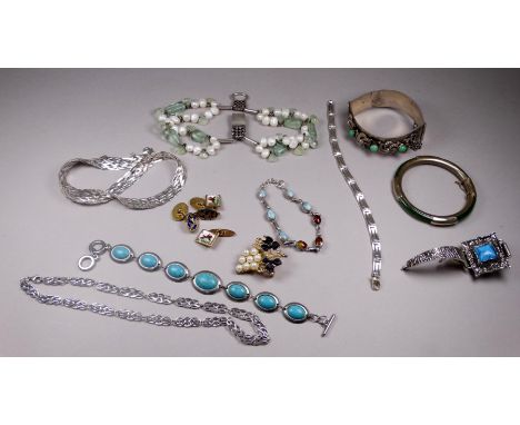 A quantity of white metal and costume jewellery - including a white metal mounted jade coloured bangle, an Asian white metal 