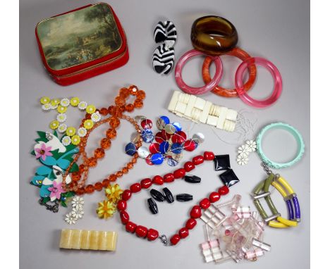 A quantity of costume jewellery - including a jade coloured floral cast bangle.