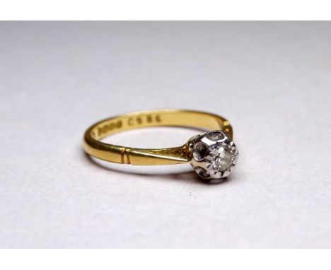 An 18ct yellow gold solitaire diamond ring - with an illusion setting, ring size N, weight 2.7g.
