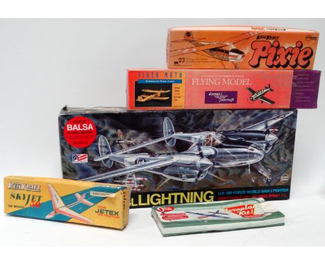 A scale balsa model kit of a Lockheed P-39 Lightning - boxed with instructions, together with four further aircraft model kit